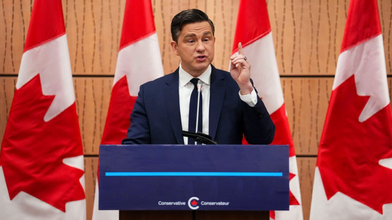 Pierre Poilievre standing at a podium